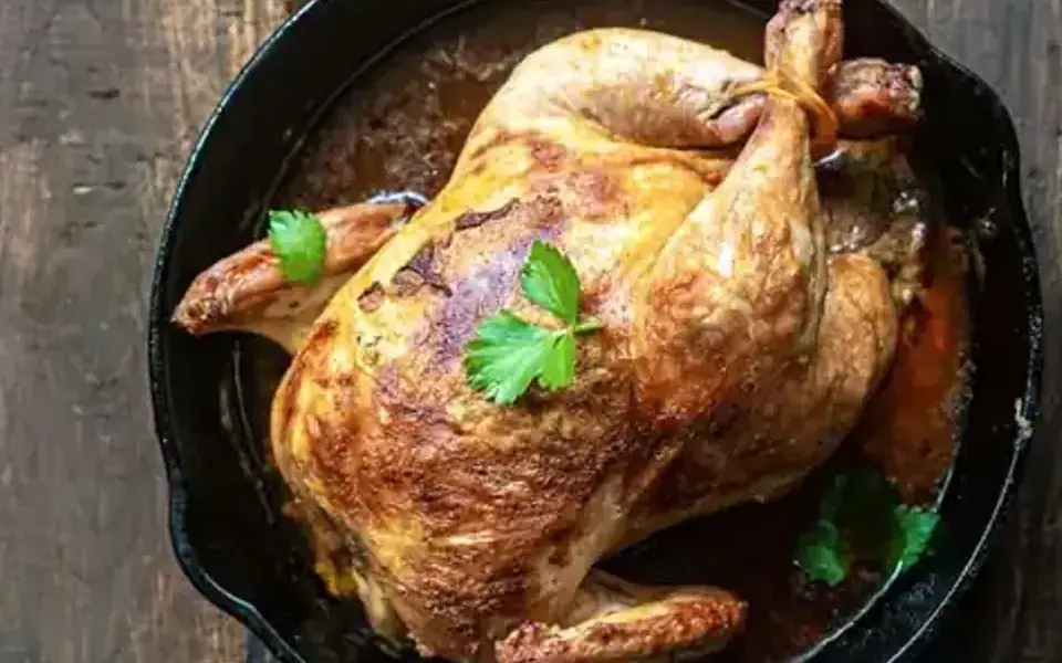 Pollo al ajillo with chicken, peppers, and potatoes