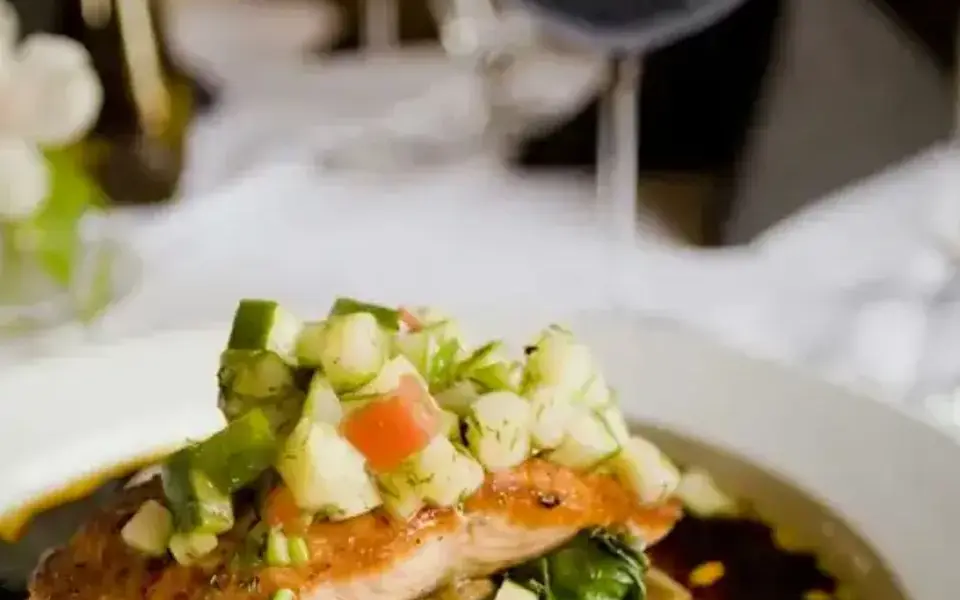 Psari plaki with fish, tomatoes, and potatoes