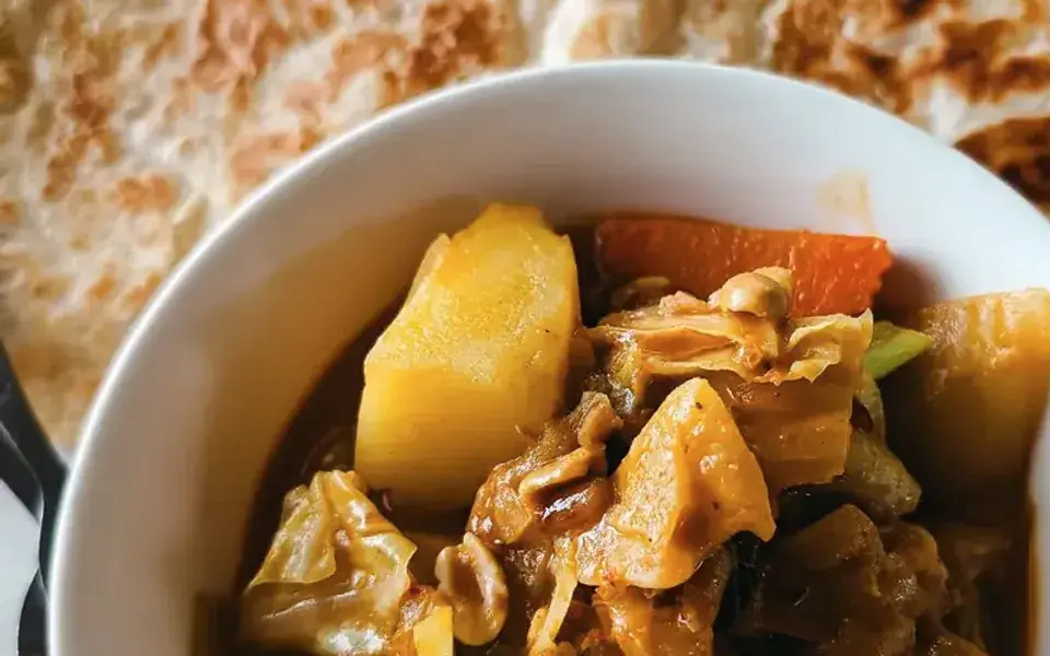 Vegetable tagine with chickpeas, zucchini, and couscous